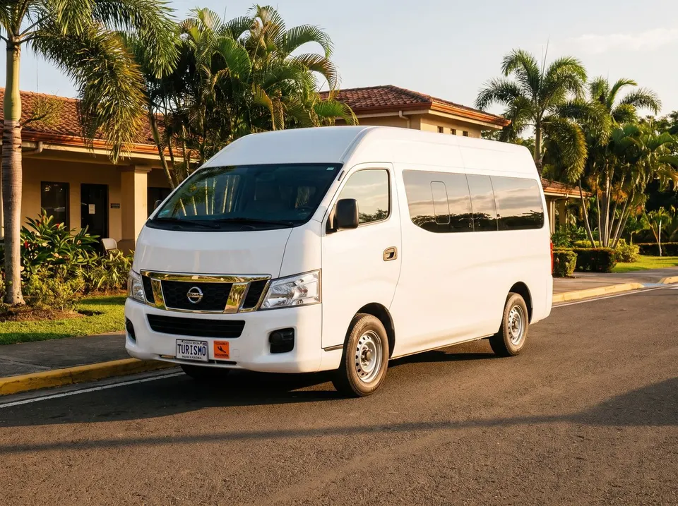 White Nissan NV350 at the airport curb